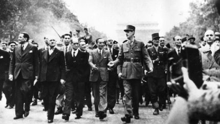 Gen. Charles de Gaulle leads a victory parade down the Champs Elysee in Paris