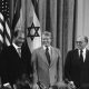 Egyptian President Anwar Sadat, U.S. President Jimmy Carter and Israeli Prime Minister Menachen Begin gather to sign the Camp David Accords