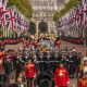 The coffin of Queen Elizabeth II is pulled past Buckingham Palace following her funeral service