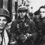 Tadeusz Rajszczak 'Maszynka', Ryszard Michał Lach, and one other young soldier from 'Miotła' Battalion in Warsaw Uprising