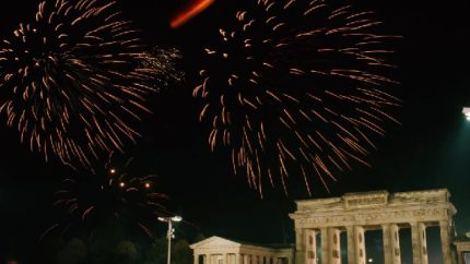 Fireworks illuminate the Brandenburg Gate in Berlin at the reunification of East and West Germany (AP Photo-Michel Euler)