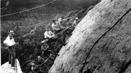 Drillers work on the George Washington head of the Mount Rushmore Memorial