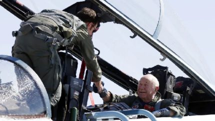 Captain David Vincent congratulates retired Air Force Brigadier General Charles Yeager after flight breaking the sound barrier (AP Photo-Isaac Brekken)