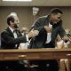 Live Crew leader Luther Campbell jumps from the defense table after a not guilty verdict was returned in the obscenity trial in Fort Lauderdale (AP Photo-Bill Cooke)