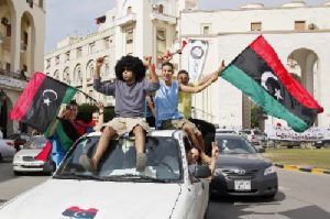 Libyans celebrate Moammar Gadhafi's death in Tripoli (AP Photo-Abdel Magid al-Fergany)