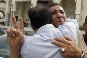  Libyans react to Moammar Gadhafi's death in Tripoli, Libya (AP Photo-Abdel Magid al-Fergany)