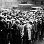 Thousands of unemployed people gather outside City Hall in Cleveland during the Great Depression (AP Photo File)