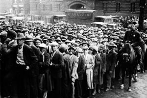 Thousands of unemployed people gather outside City Hall in Cleveland during the Great Depression (AP Photo File)