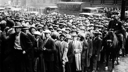 Thousands of unemployed people gather outside City Hall in Cleveland during the Great Depression (AP Photo File)