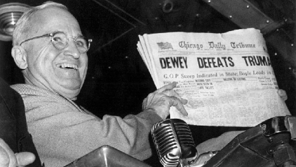 President Harry Truman holds up an election day edition of the Chicago Daily Tribune mistakenly reporting 'Dewey Defeats Truman' (AP Photo-Byron Rollins)