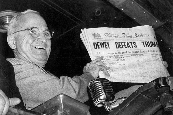 President Harry Truman holds up an election day edition of the Chicago Daily Tribune mistakenly reporting 'Dewey Defeats Truman' (AP Photo-Byron Rollins)