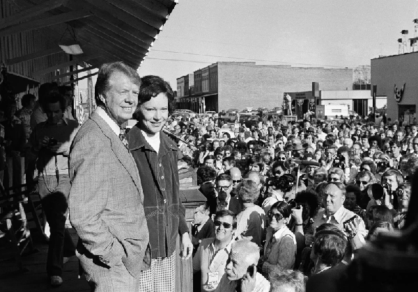 President-elect Jimmy Carter tells a group of people gathered at the train station about a congratulatory phone call he received from President Ford (AP Photo)