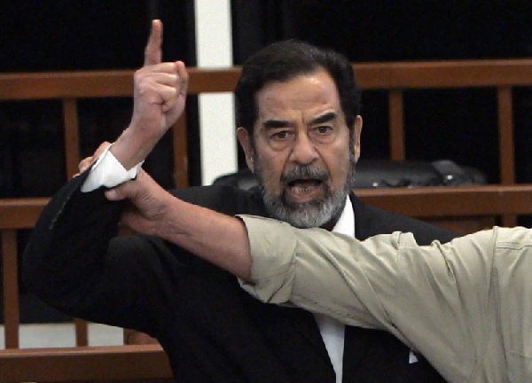  Iraq’s High Tribunal find Saddam Hussein guilty of crimes against humanity and sentence him to die by hanging (AP Photo-David Furst, Pool)