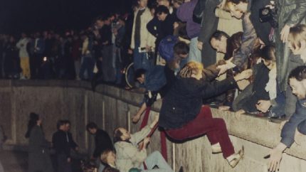 East German citizens applauded by West Berliners when they cross Checkpoint Charlie to visit West Berlin (AP Photo-Thomas Kienzle, File)