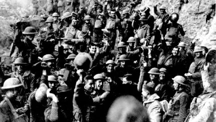 American troops cheer after hearing the news that the Armistice had been signed, ending World War I (AP Photo)