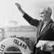 Arne Petterson, the last alien to leave Ellis Island before its closing, waves from the ferry boat Ellis Island (AP Photo)