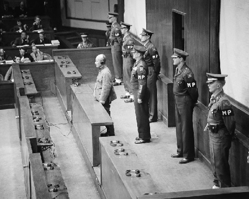 Hideki Tojo, former prime minister of Japan and war leader, stands in the dock before the International Military Tribunal in Tokyo (AP Photo-Charles Gorry)