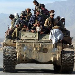 Afghan opposition fighters rolled into Kabul on Tuesday after Taliban troops slipped away under cover of darkness, leaving without a fight (AP Photo-Marco Di Lauro)