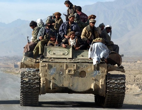 Afghan opposition fighters rolled into Kabul on Tuesday after Taliban troops slipped away under cover of darkness, leaving without a fight (AP Photo-Marco Di Lauro)