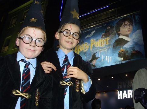  Harry Potter fans arrive at a London cinema for a showing of the first Harry Potter film on the day of its general release (AP Photo-Alastair Grant)