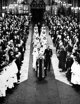 Britain’s Princess Elizabeth and the Duke of Edinburgh walk down the aisle of Westminster Abbey after their wedding service (AP Photo)