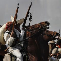 Soldiers re-enact a revolution battle as part of Mexican Revolution anniversary celebrations (AP Photo, Marco Ugarte)