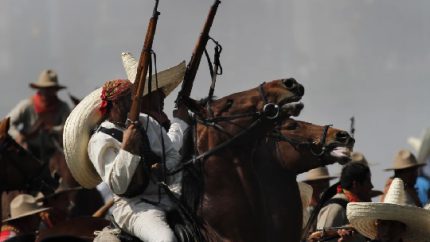 Soldiers re-enact a revolution battle as part of Mexican Revolution anniversary celebrations (AP Photo, Marco Ugarte)