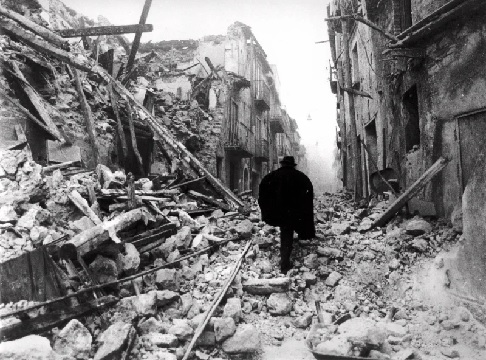  In aftermath of earthquakes a man makes his way on a street covered with rubble in the small town of Balvano, near Potenza, southern Italy (AP Photo-Gianni Foggia)