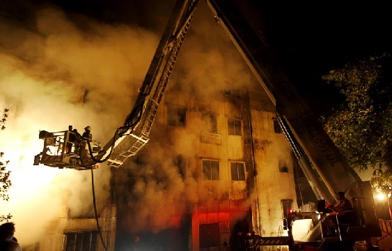 Bangladeshi firefighters battle a fire at a garment factory in the Savar neighborhood in Dhaka, Bangladesh (AP Photo-Hasan Raza)