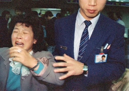  A woman reacts with grief at Seoul’s Kimpo International Airport after learning that a Korean passenger plane carrying a relative had disappeared over Burma (AP Photo)