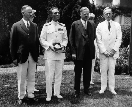 Rear Admiral Richard E Byrd was presented with a special gold medal of the National Geographic Society, by President Herbert Hoover at the White House (AP Photo)