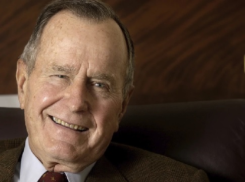 Former President George Bush talks about skydiving during an interview at his Houston office (AP Photo - David J. Phillip)