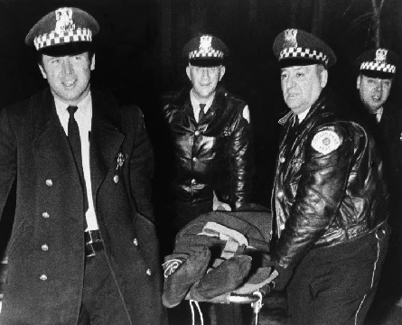 Chicago police remove the body of Fred Hampton, leader of the Illinois Black Panther Party, slain by police (AP Photo)