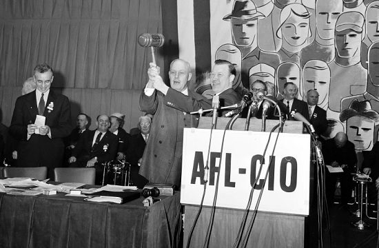 Labor leaders George Meany and Walter Reuther pronounce the merger of the American Federation of Labor and the Congress of Industrial Organizations (AP Photo)