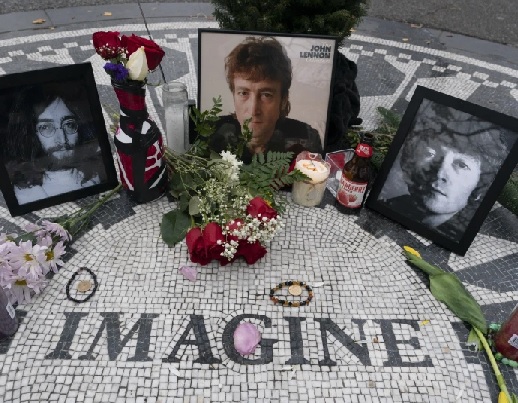  Photos, flowers and candles are left at Strawberry Fields in New York’s Central Park to remember John Lennon (AP Photo - Mark Lennihan)