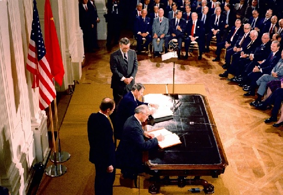 President Ronald Reagan and Soviet leader Mikhail Gorbachev sign a treaty to eliminate intermediate-range missiles (AP Photo - Bob Daugherty)