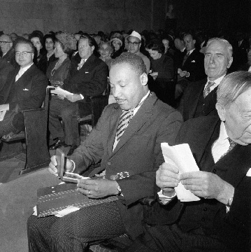 Dr Martin Luther King looks at his Nobel Peace Prize in Oslo, Norway (AP Photo)