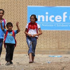 In September, 2013, Syrian refugee children receive items for school from UNICEF at a refugees camp in Iraq (AP Photo - Ceerwan Aziz