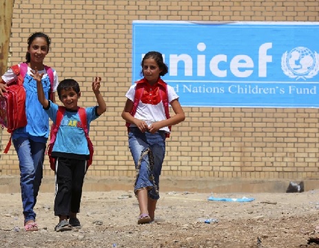 In September, 2013, Syrian refugee children receive items for school from UNICEF at a refugees camp in Iraq (AP Photo - Ceerwan Aziz