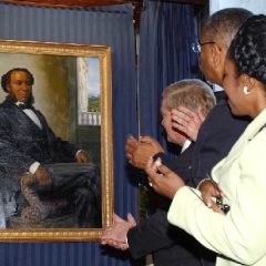 A painting of Joseph H Rainey, the first black person elected to Congress, is unveiled on Capitol Hill in 2005 (AP Photo - Dennis Cook)