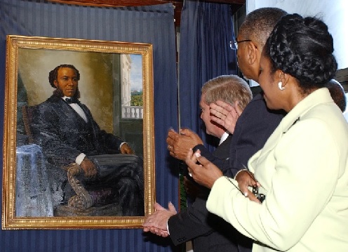  A painting of Joseph H Rainey, the first black person elected to Congress, is unveiled on Capitol Hill in 2005 (AP Photo - Dennis Cook)