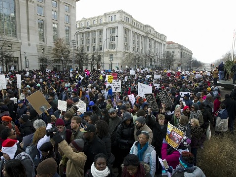 Demonstrators march during the 'Justice for All' march to protest the deaths of unarmed black men at the hands of police (AP Photo - Jose Luis Magana)