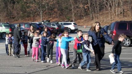 Children were told to close their eyes as they were guided to safety from the school building (uncredited)