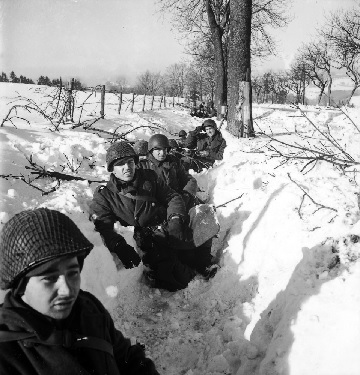 American troops in a snow-filled trench during the Battle of the Bulge (The LIFE Picture Collection)