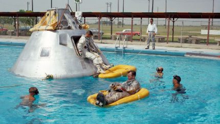 Prime crew members for the first manned Apollo 1 space flight practice water egress procedures in a swimming pool