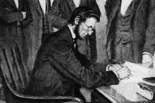 President Lincoln signs the Emancipation Proclamation